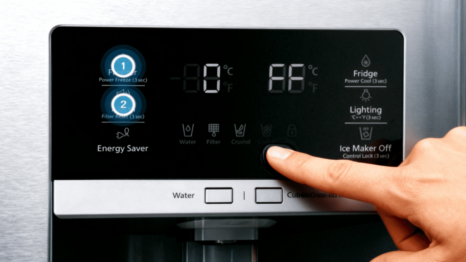 A close-up photo of a French door refrigerator control panel showing an energy saver or humidity control button