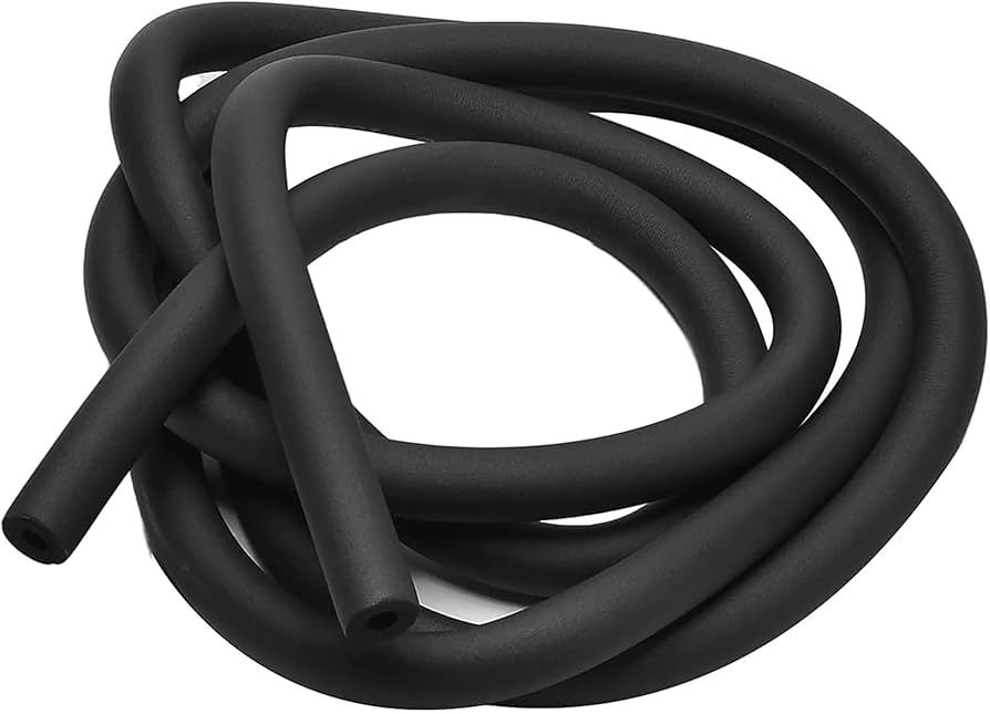 A close-up photo of a foam insulation sleeve installed around a refrigerator water supply tube near a wall, realistic DIY scene