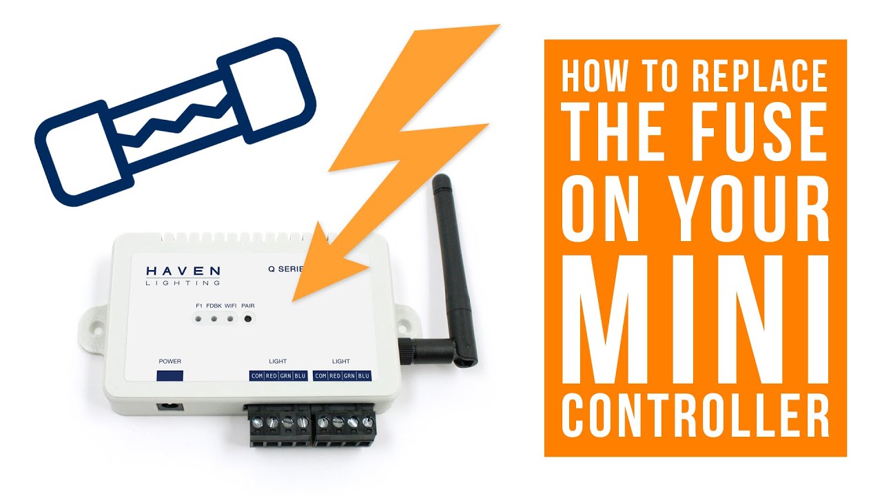 A close-up photo of a hand holding a small blade fuse in front of an open irrigation controller panel, realistic photo