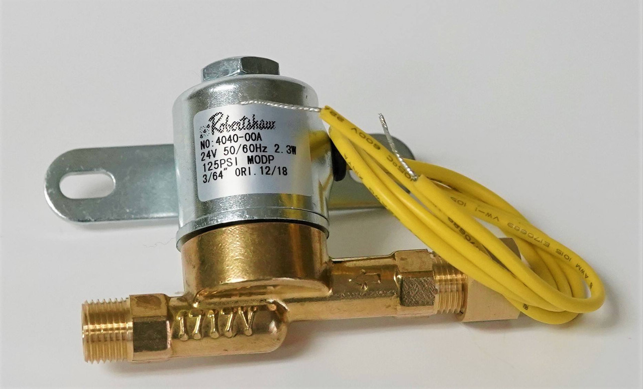 A close-up photo of a humidifier solenoid valve mounted on the side of a furnace humidifier, showing the small water line inlet and two low-voltage wires