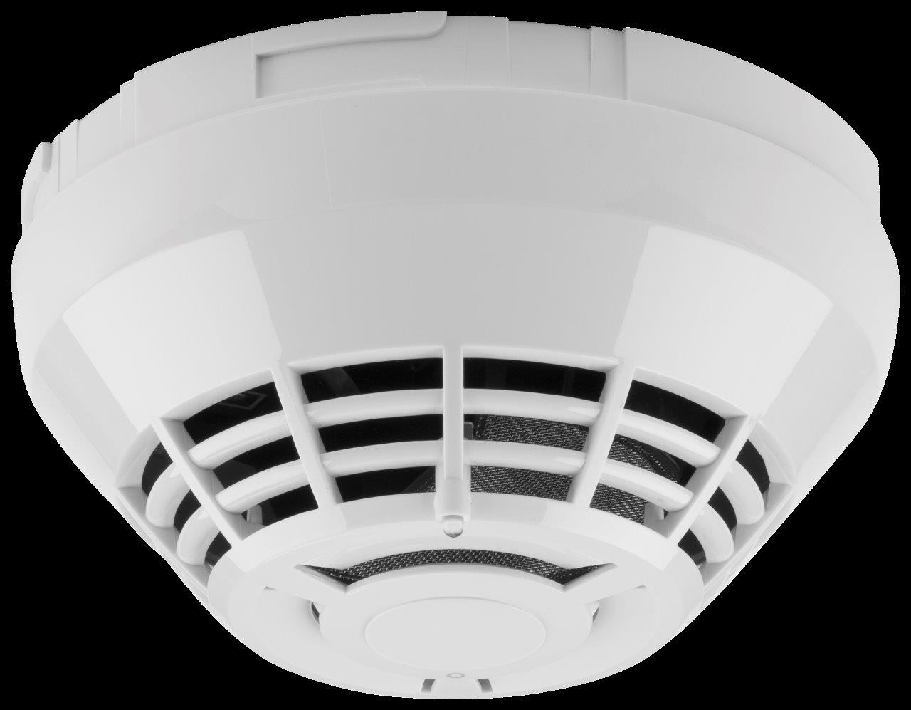 A close up real photograph of a white photoelectric smoke detector mounted on a textured ceiling in a home