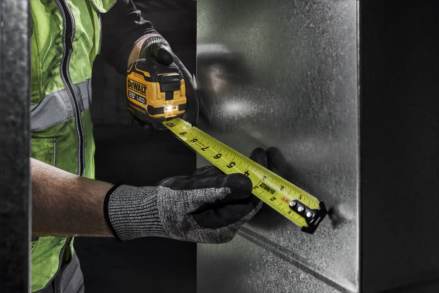 A cordless drill, small torpedo level, tape measure, pencil, and screwdriver laid out on a workbench for a window blind installation