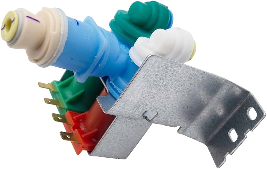 A photo of the back lower area of a refrigerator with the access panel removed, showing the water inlet valve where the supply line connects