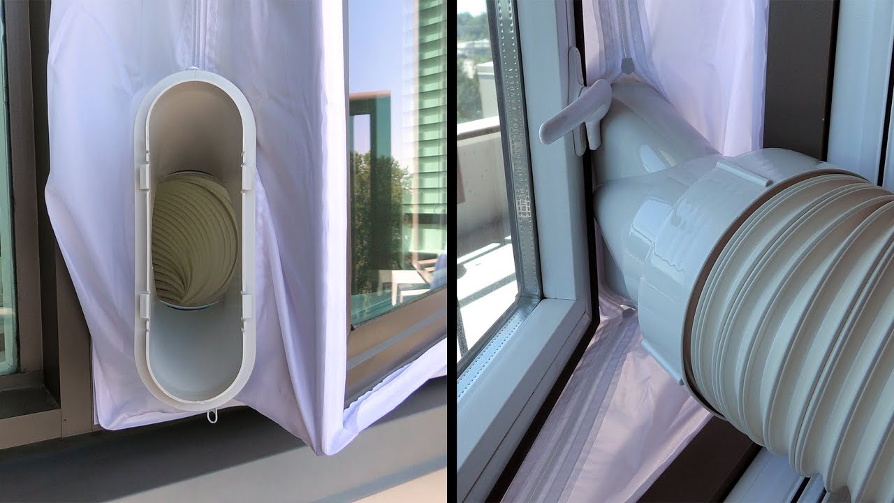 A portable air conditioner positioned near a window with the exhaust hose securely attached to a window vent kit, in a real living room