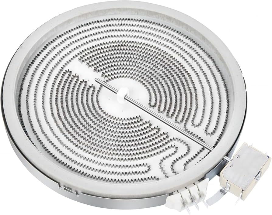 A real photo of a glass-top electric range with the cooktop lifted to reveal a circular radiant heating element assembly underneath