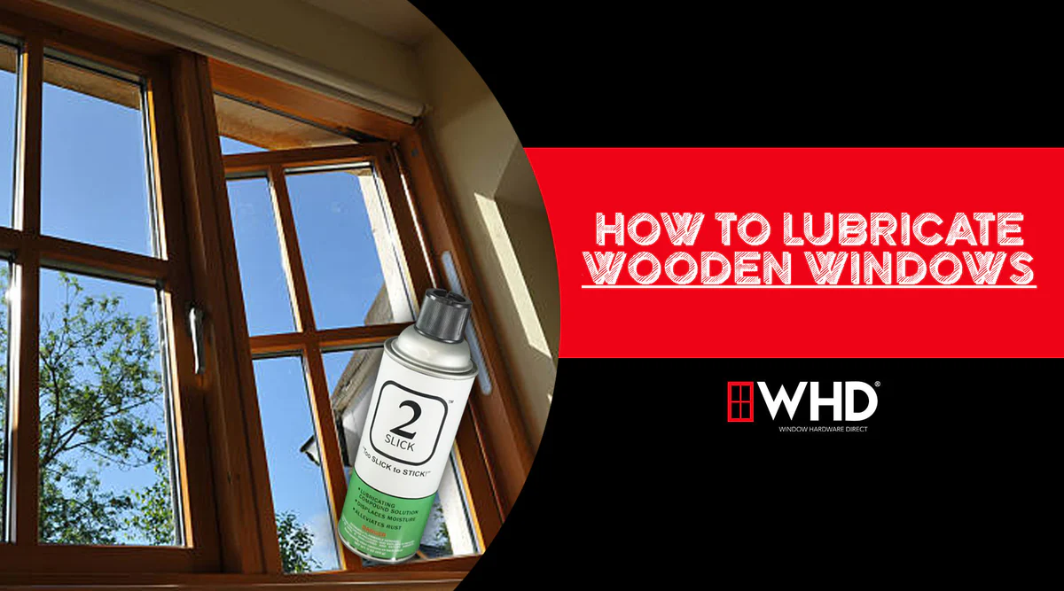 A real photo of a homeowner applying a small amount of silicone or PTFE spray to the side track of a wood window sash, with a cloth held underneath to catch drips