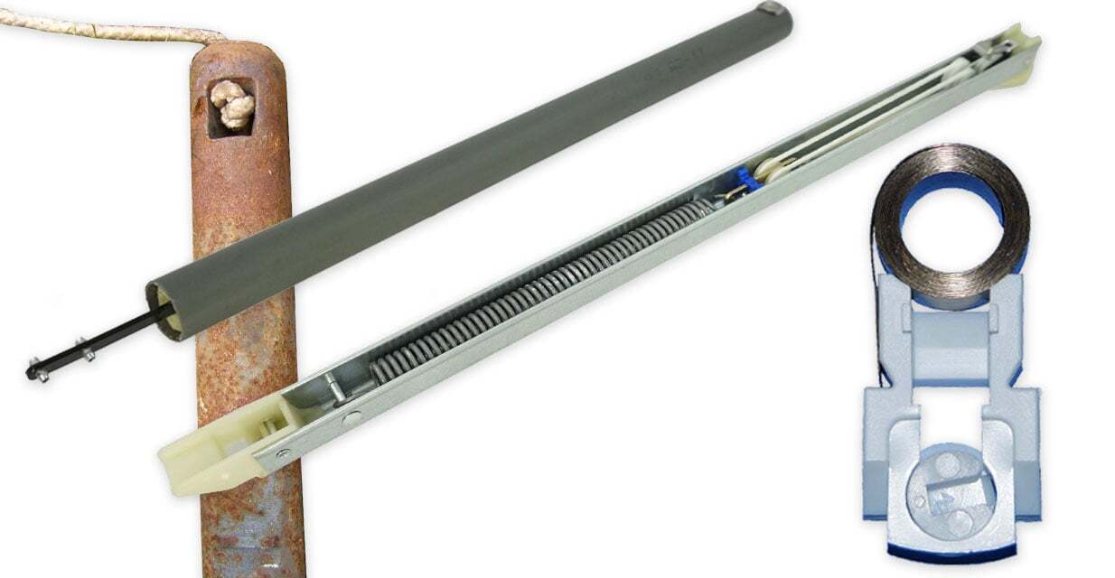 A real photo of the side jamb of a double-hung window showing the balance channel and a disconnected or slack balance component near the sash