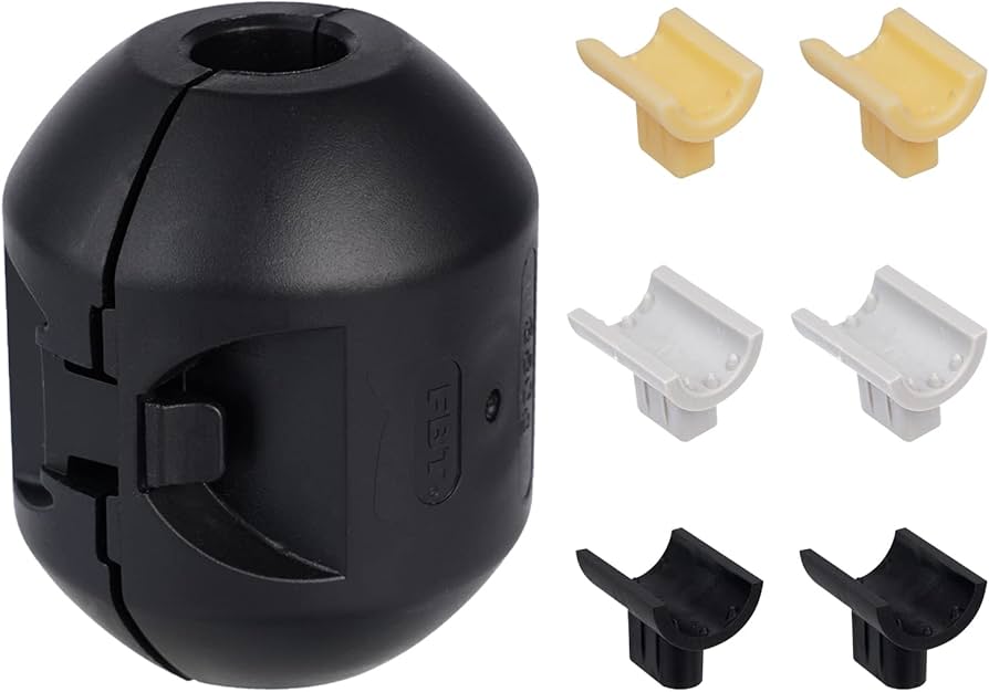 A real under-sink view of a pull-down faucet hose with a metal or plastic weight clipped onto the hose, photographed inside a kitchen cabinet