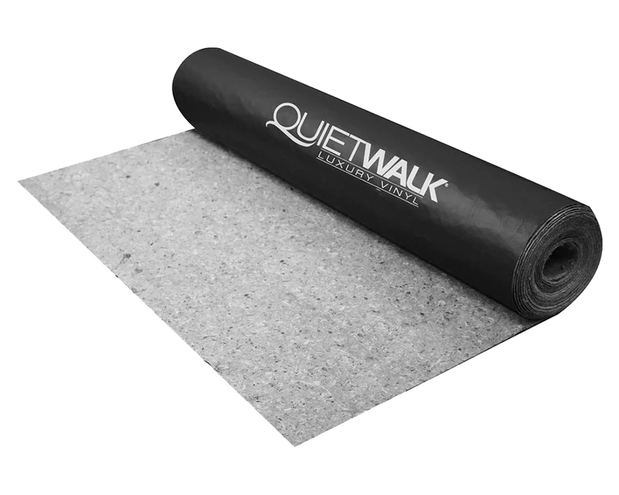 A roll of vinyl plank underlayment partially unrolled on a clean plywood subfloor, ready for installation