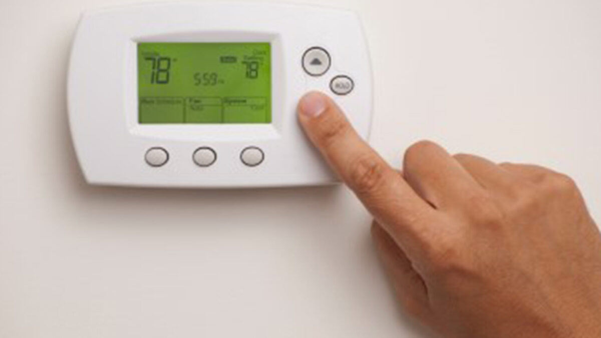 A smart thermostat screen showing a hold setting used to maintain a fixed temperature while away