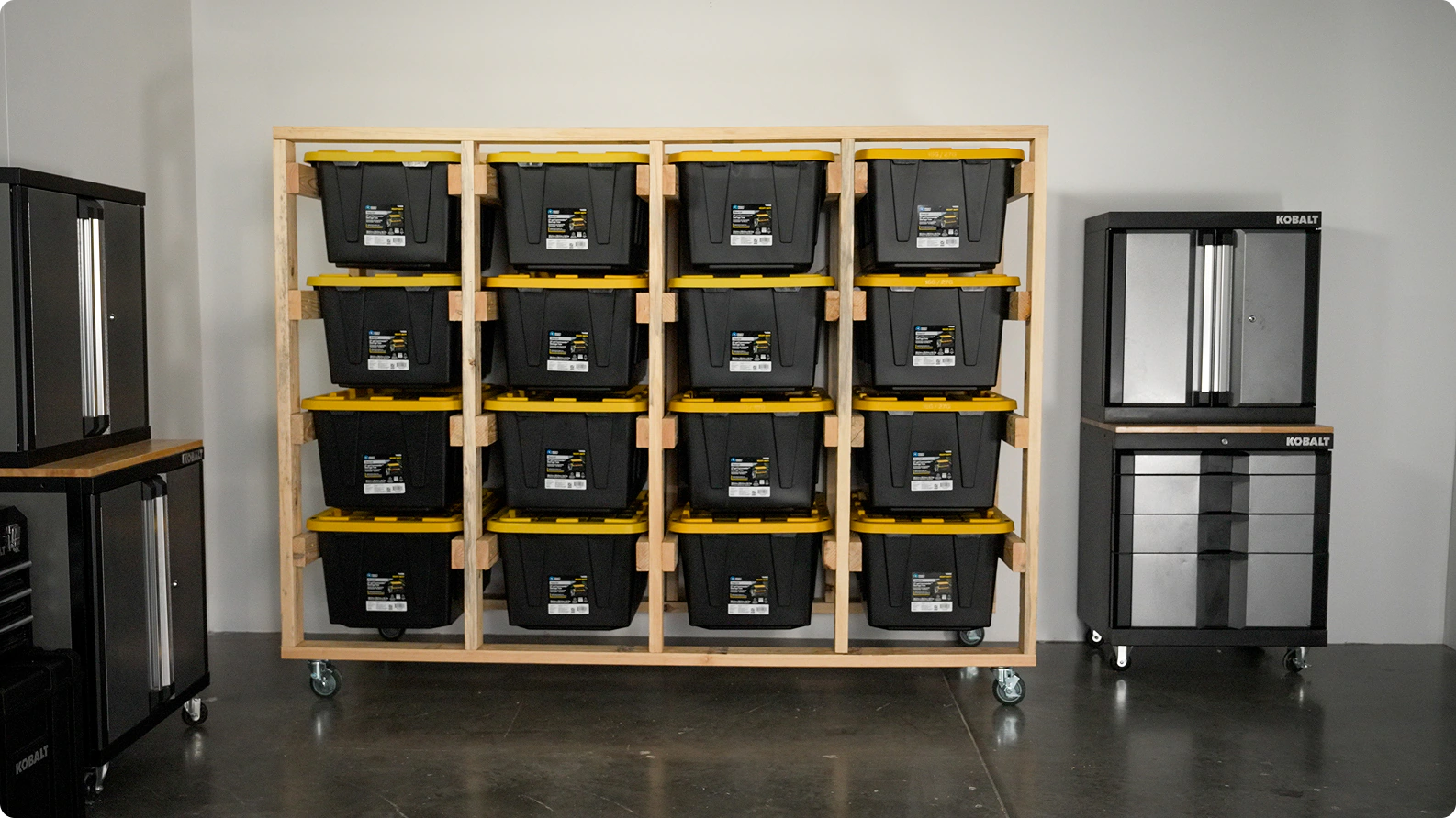 Clear plastic storage bins with lids organized on shelving, with the floor area underneath kept clear